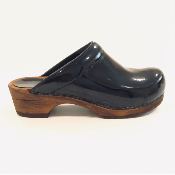 sanita black patent clogs